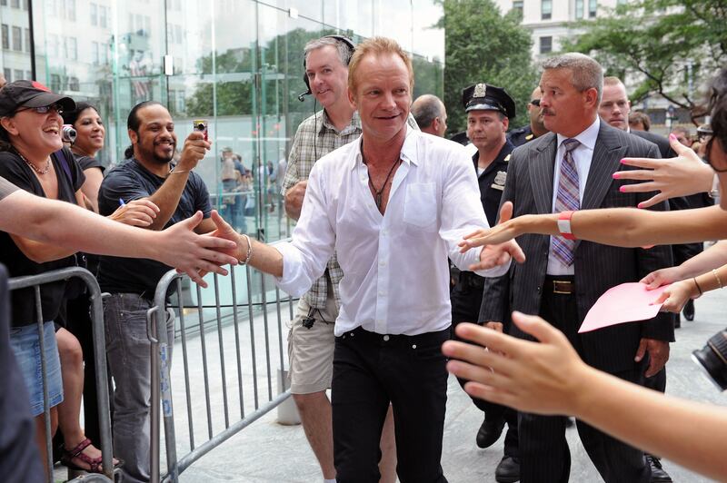 Sting shakes hands of fans after performing on CBS's 'The Early Show' at CBS Early Show Studio Plaza on July 15, 2010 in New York City. Getty Images via AFP