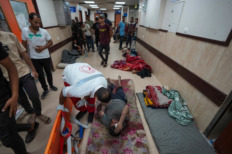 Palestinians wounded in an Israeli bombardment are brought to Al Aqsa Martyrs Hospital in Deir Al Balah, central Gaza. AP Photo