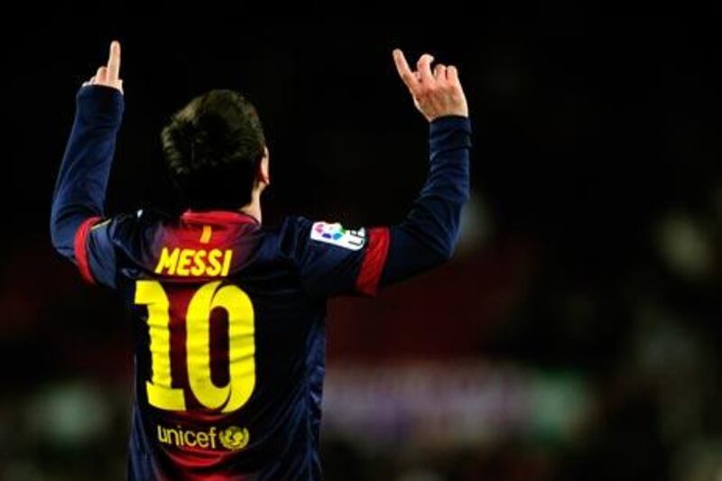 Lionel Messi reacts after scoring against Sevilla last night. Manu Fernandez / AP Photo