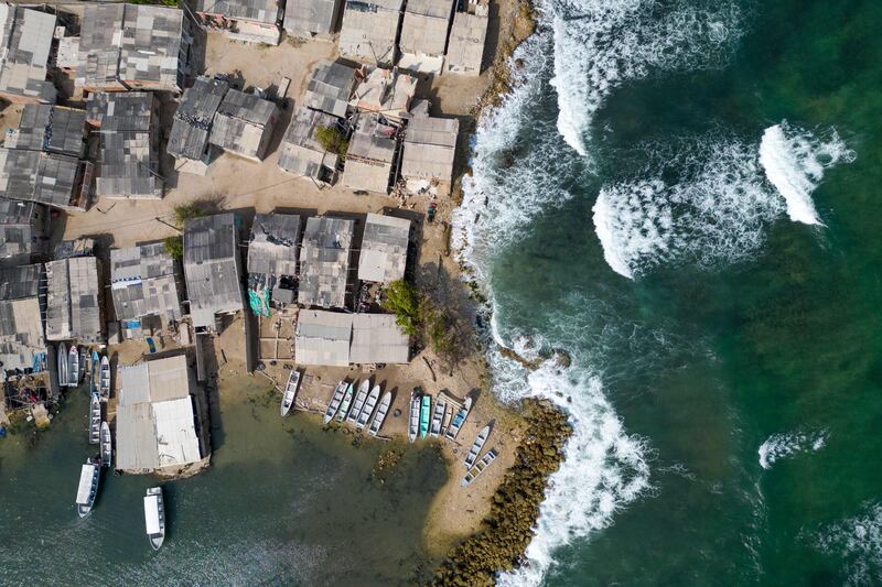 Houses show the rising sea levels in Tierra Bomba Island, Cartagena. Colombia's most touristic city could be partially underwater this century. AFP