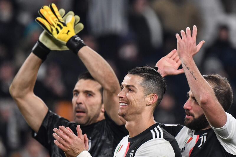 Left to right: Gianluigi Buffon, Cristiano Ronaldo and Gonzalo Higuain after the match. AFP