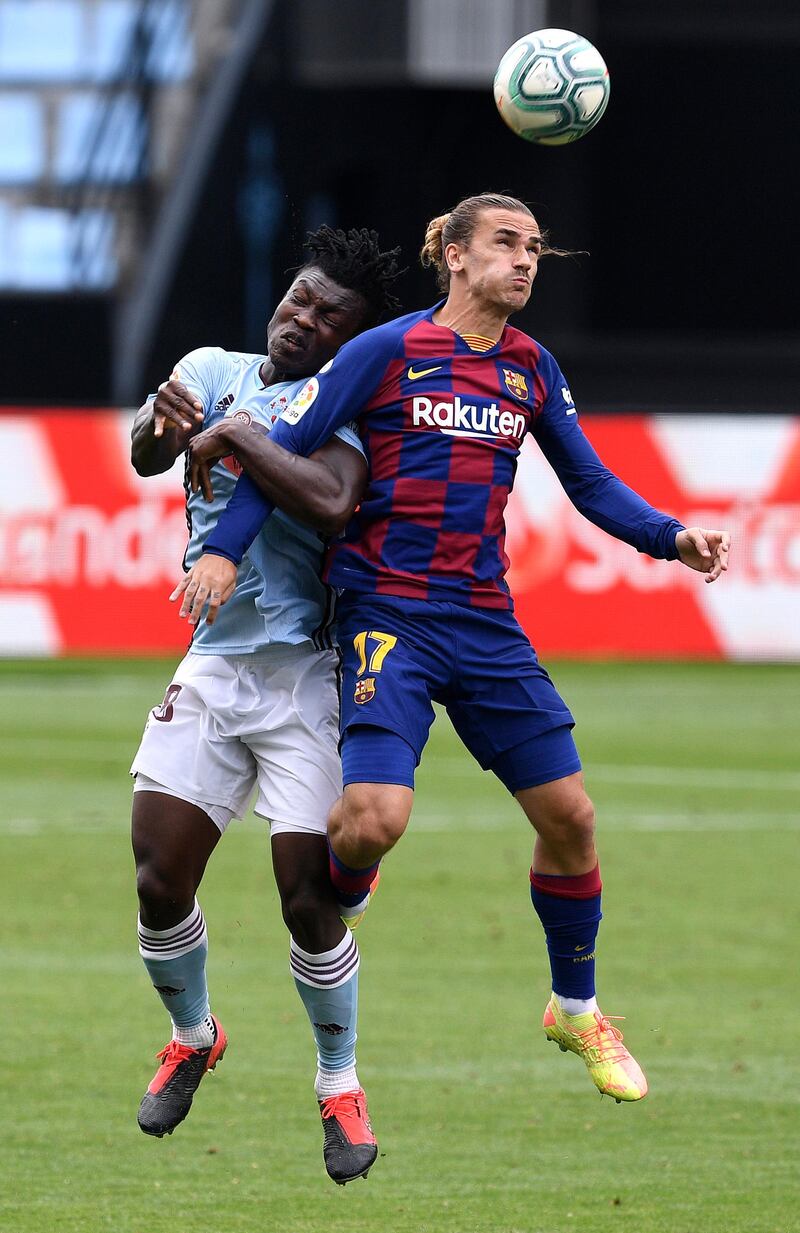 Barca's Antoine Griezmann and Joseph Aidoo of Celta Vigo challenge for the ball during the La Liga match at the Estadio de Balaídos on June 27, 2020. Griezmann came on as a sub with nine minutes to go. Getty