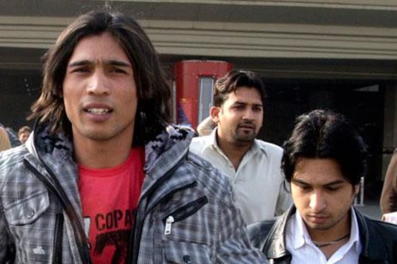 Pakistani left-arm paceman Mohammad Amir, left, is getting support from his mentor, Asif Bajwa, who is asking the ICC to review the 19 year old's five-year ban for spot-fixing.