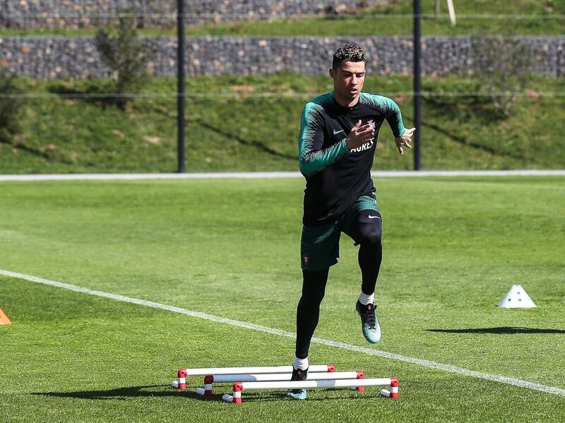 Cristiano Ronaldo performs during his team's training session at Cidade do Futebol in Oeiras, near Lisbon. Antonio Cotrim / EPA