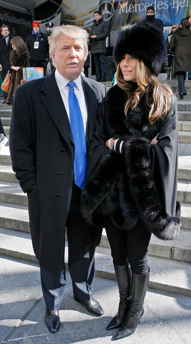 epa00925351 Donald and Melania Trump exit the Michael Kors Fashion Show at Mercedes- Benz Fashion Week in New York City, Wednesday February 07, 2007.  EPA/PETER FOLEY