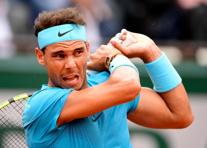 epa06771160 Rafael Nadal of Spain wins against Simone Bolelli of Italy in their men’s first round match during the French Open tennis tournament at Roland Garros in Paris, France, 29 May 2018.  EPA/CAROLINE BLUMBERG