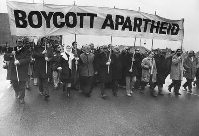 20th December 1969: Anti-apartheid marchers, including David Sheppard, Bishop of Woolwich (second left) and (from left) Anne Kerr MP, Methodist preacher and christian socialist Lord Donald Soper and Ian Mikardo MP, on their way to Twickenham rugby ground.   (Photo by Central Press/Getty Images)