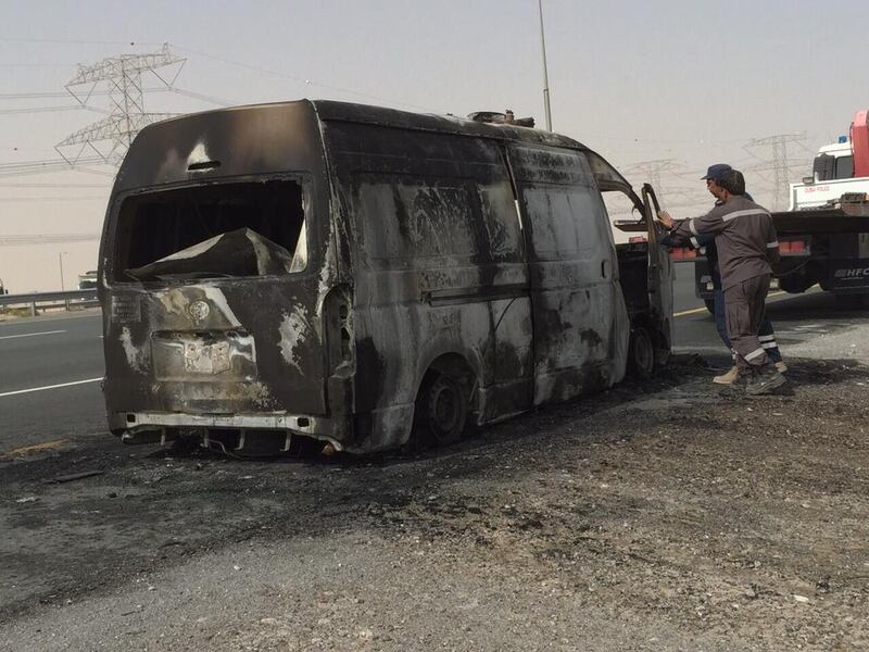 A minivan burst into flames at around 8.15am in Dubai, resulting in heavy congestion. The incident took place on Emirates Road, Abu Dhabi bound. Courtesy Dubai Police