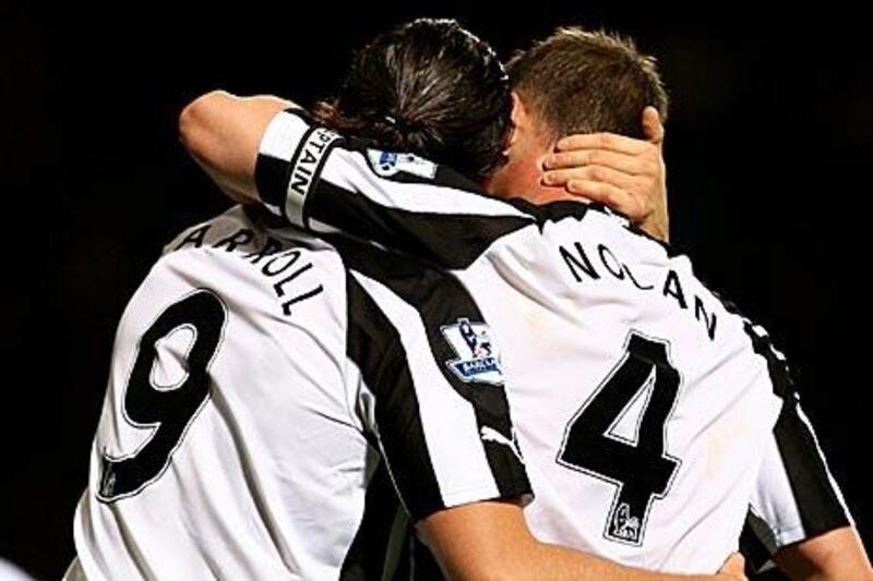 Newcastle United’s Andy Carroll, left, illustrates he and his captain, Kevin Nolan, are on good terms after they teamed up impressively to defeat West Ham United on Saturday.