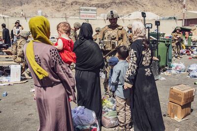 US Marines with the 24th Marine Expeditionary Unit (MEU) process evacuees at the Hamid Karzai International Airport in Kabul on August 28. US Marine Corps/ Reuters