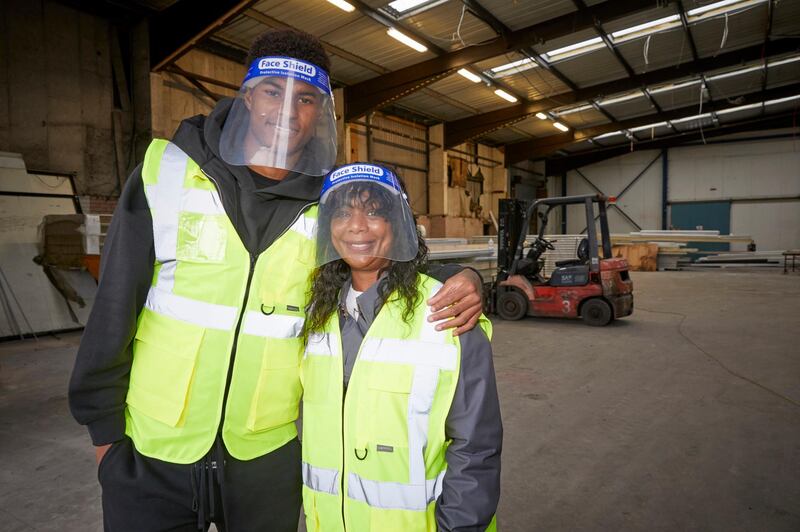 Manchester United player Marcus Rashford and his mother Melanie visit FareShare Greater Manchester at New Smithfield Market, Manchester. AP Photo
