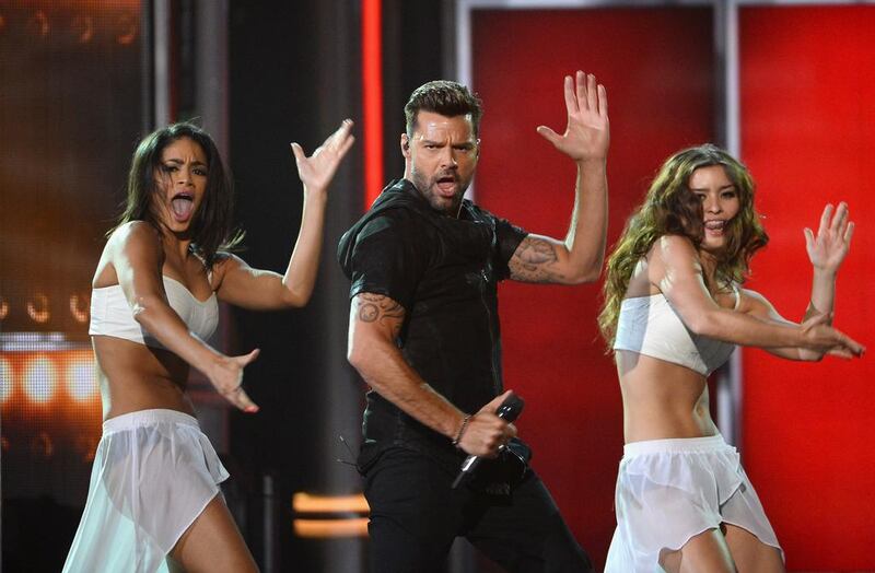 Recording artist Ricky Martin, centre, performs. Ethan Miller / Getty Images / AFP