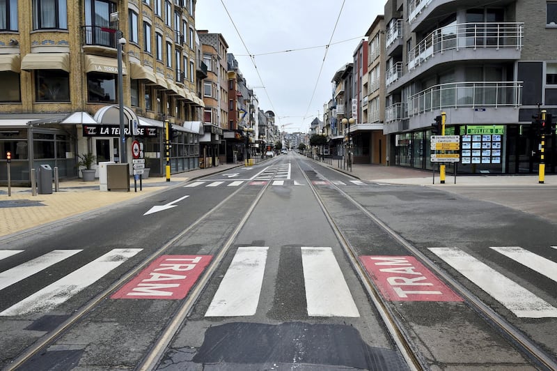 This picture taken on March 20, 2020 shows the deserted streets of Belgium's West Flanders city of Koksijde as a lockdown is in effect in the country to prevent the spread of the COVID-19 caused by the novel coronavirus. (Photo by JOHN THYS / AFP)