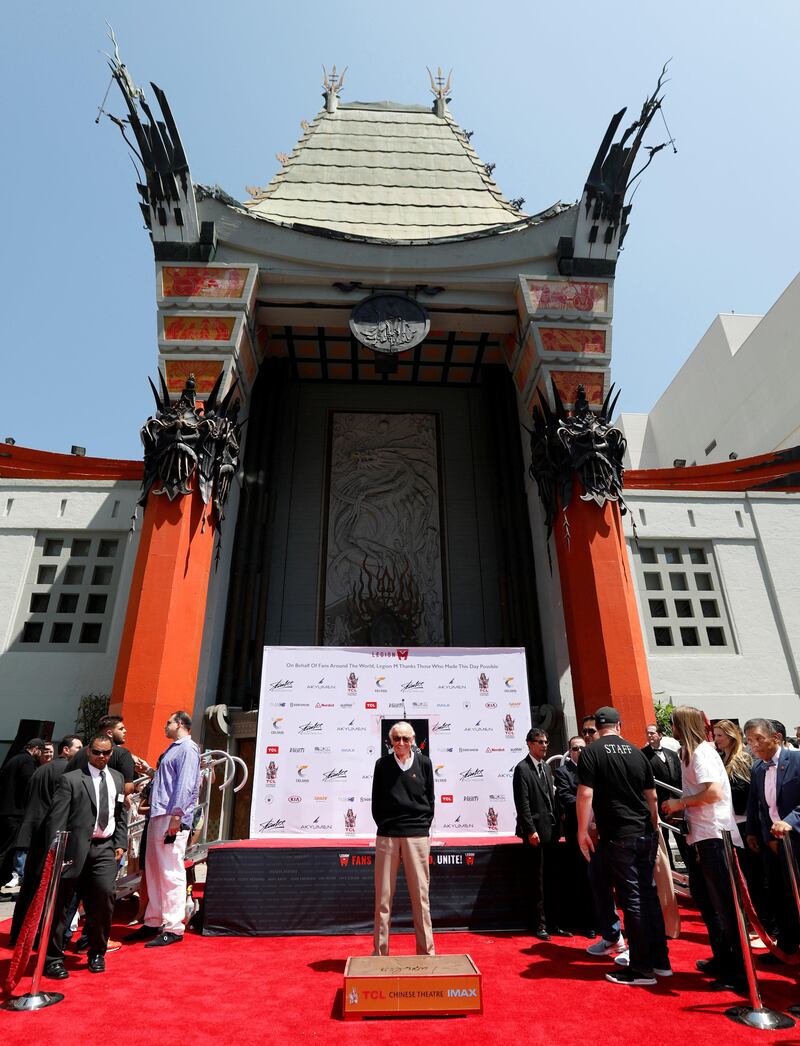 Marvel Comics co-creator Stan Lee poses after placing his handprints, footprints and signature in cement during a ceremony in the forecourt of the TCL Chinese theatre. Mario Anzuoni / Reuters