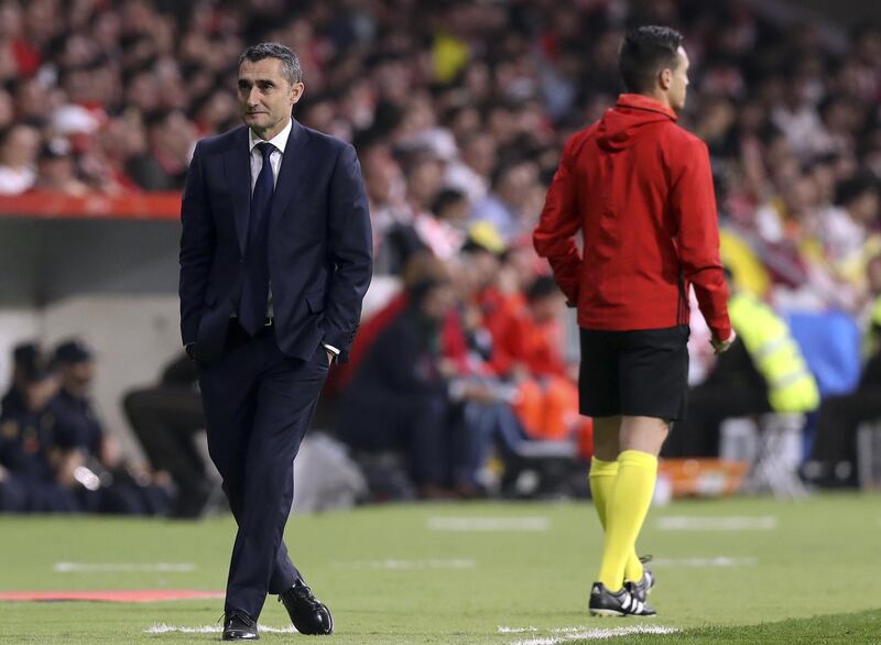 Barcelona manager Ernesto Valverde, left, reacts during their Copa del Rey match against Sevilla at the Wanda Metropolitano stadium in Madrid. Ballesteros / EPA
