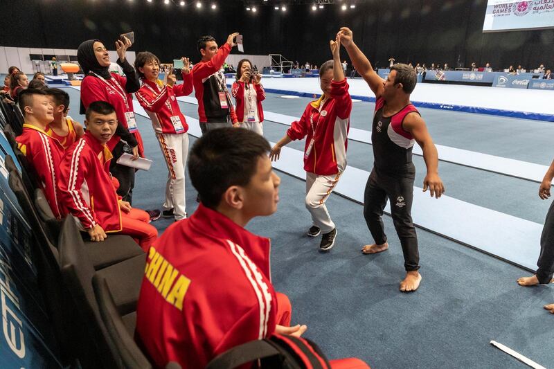 ABU DHABI, UNITED ARAB EMIRATES. 15 MARCH 2019. Special Olympics action at ADNEC. An Egypt and China athlete does an iimpromto dance. (Photo: Antonie Robertson/The National) Journalist: None: National.