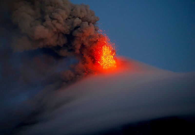 The Mayon volcano spews red-hot lava in another eruption as seen from Legazpi city, Albay province southeast of Manila, Philippines. Bullit Marquez / AP Photo