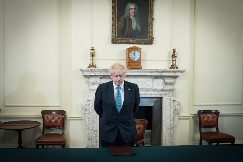 Mr Johnson in the Cabinet Room observing a minute's silence in April 2020 in a tribute to the health staff and key workers who died during the coronavirus outbreak. PA