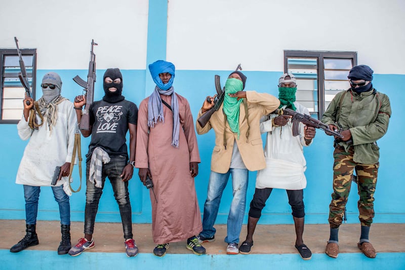 Togolese policemen disguised as terrorists for an anti-terrorism exercise at the Peacekeeping Operations Training Centre. Togo and neighbouring West African coastal states Ghana and Benin are preparing for growing spill-over from extremist-fuelled conflicts across their northern borders in Niger and Burkina Faso. October 20, 2022. AFP