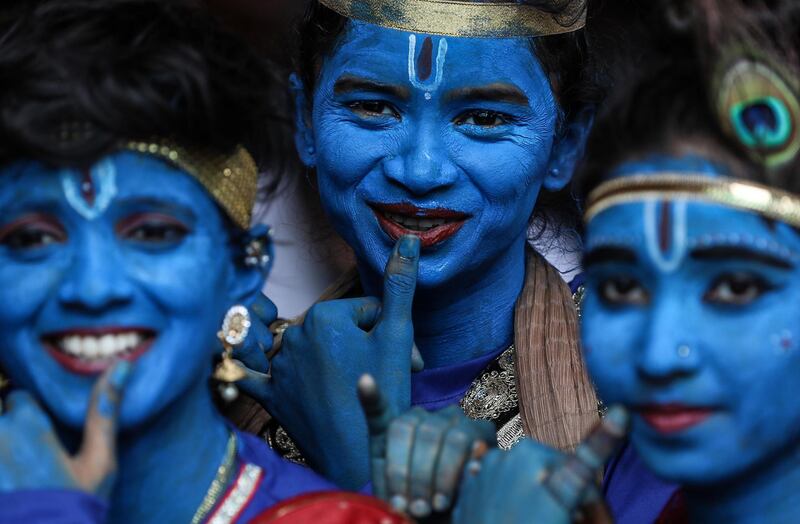 Indian college girls dressed as Lord Krishna pose for photograph during Janamashtami festival celebrations at Shreemati Nathibai Damodar Thackersey (SNDT) college in Mumbai, India,  EPA