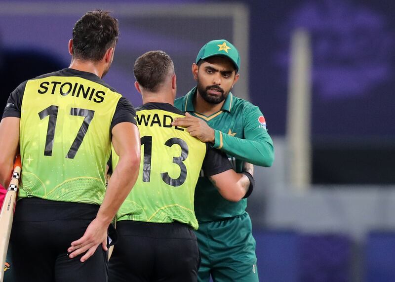 Pakistan captain Babar Azam congratulates Australia's Matthew Wade for winning the match.