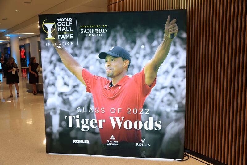 Signage displaying an image of Tiger Woods during the 2022 World Golf Hall of Fame Induction. AFP