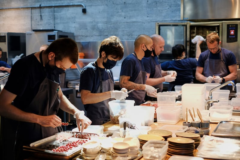 (FILES) In this file photo taken on May 31, 2021 personnel of the world class Danish restaurant Noma work in the kitchen in Copenhagen.  - Noma and its star chef René Redzepi and Geranium, commissioned by Rasmus Kofoed, took first and second place in the newly published ranking of the 50 best restaurants in the world held by the British magazine Restaurant.  (Photo by Thibault Savary  /  AFP)