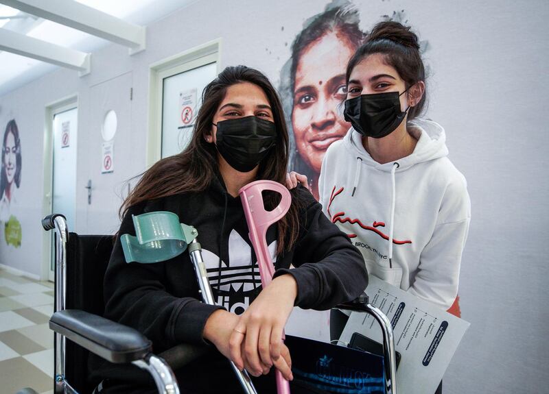 Abu Dhabi, United Arab Emirates, January 12, 2021. SEHA Vaccination Centre at the Abu Dhabi Cruise Terminal area.  Sisters Aya-24 and Jana-18 get vaccinated.
Victor Besa/The National
Section:  NA
Reporter:  Shireena Al Nowais