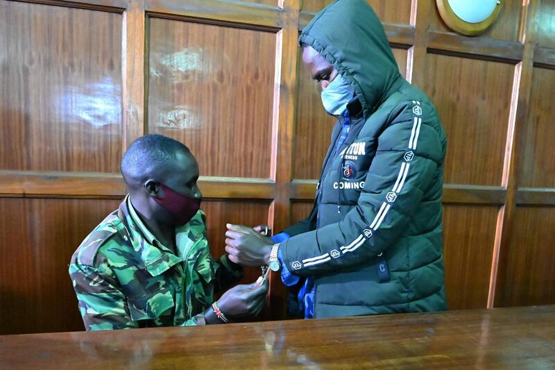 Hassan Hussein Mustafa is being handcuffed after he was found guilty of aiding the gunmen involved in the Westgate Mall attack of September 2013.  AFP