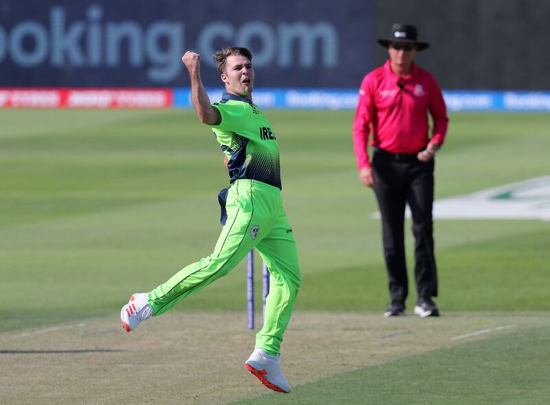 Ireland bowler Curtis Campher celebrates after taking the wicket of Netherlands Roelof van der Merwe at Zayed Cricket Stadium in Abu Dhabi. Ireland won the game by seven wickets. Chris Whiteoak / The National