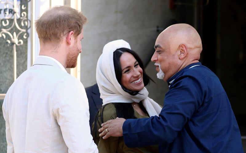 The royals are greeted as they arrive at the mosque in the Bo Kaap district of Cape Town. Reuters