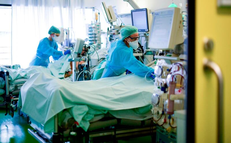 Medical staff take care of a Covid-19 patient in an intensive care unit at the University hospital of Aachen, western Germany during the novel coronavirus COVID-19 pandemic.  AFP