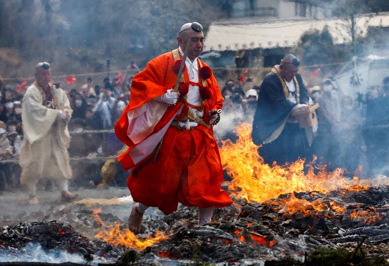 Buddhist monks walk barefoot over smouldering coals during the fire-walking festival, called Hiwatari Matsuri, in Tokyo, Japan. Reuters