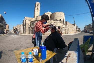 A barber in the old city of Mosul, Iraq April 18, 2020. Reuters