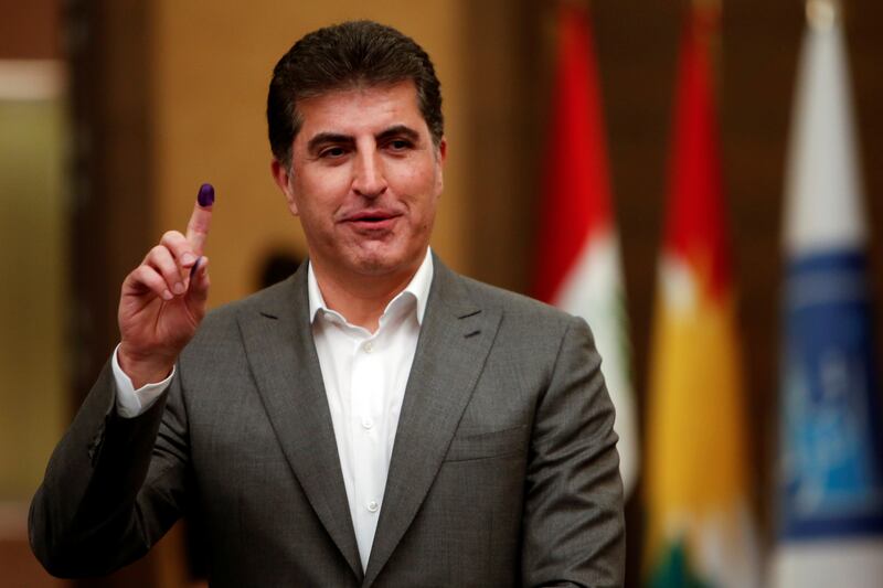 Nechirvan Barzani shows his ink-stained finger after voting in Erbil. Reuters