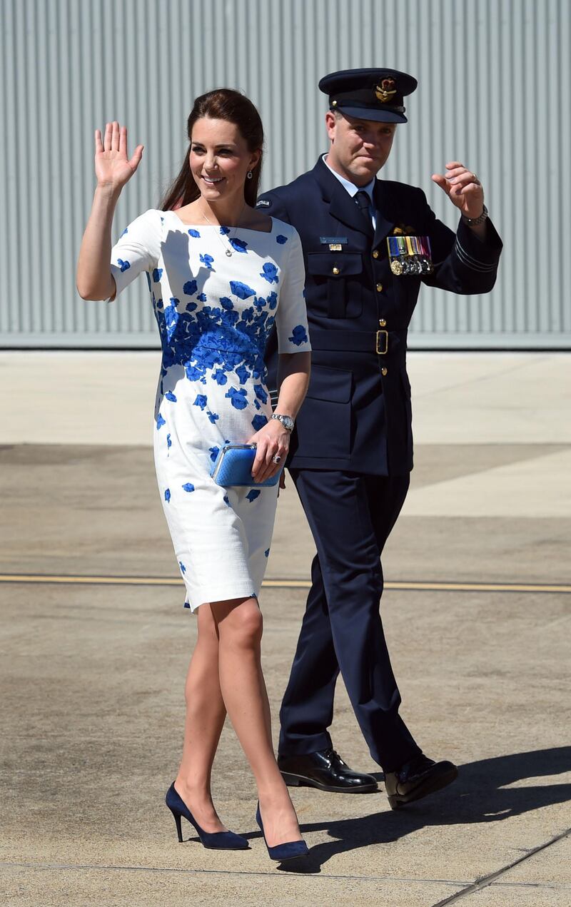 BRISBANE, AUSTRALIA - APRIL 19:  Catherine, Duchess of Cambridge (L) and Commanding Officer of Number 1 Squadron , Wing Commander Stephen Chappell (R) walk from a RAAF Super Hornet of 1 Squadron at the Royal Australian Airforce Base at Amberley on April 19, 2014 in Brisbane, Australia. The Duke and Duchess of Cambridge are on a three-week tour of Australia and New Zealand, the first official trip overseas with their son, Prince George of Cambridge. (Photo by William West - Pool/Getty Images)
