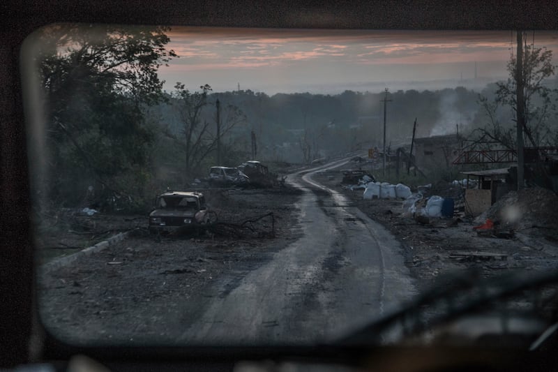 The gutted remains of cars lie along a road during heavy fighting in Severodonetsk. AP