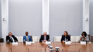 Federal Reserve Chairman Jerome Powell, centre, and other members of the Federal Open Market committee at the Fed building in Washington. Bloomberg