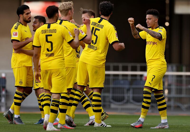 Sancho  celebrates the third with his teammates. Getty