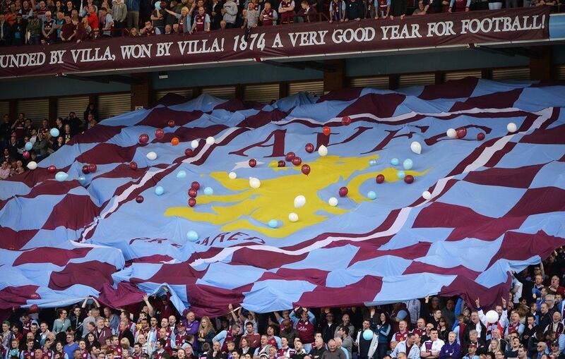 Aston Villa fans display a club flag during the Premier League match against Hull City on Saturday. Ross Kinnaird / Getty Images / May 3, 2014 