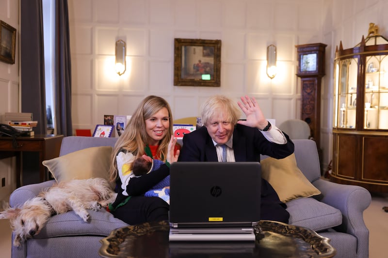23/12/2021. Chequers, United Kingdom. Prime Minister Boris Johnson and his wife Carrie Johnson, with their daughter Romy, hold video calls from Chequers with Doctor Laura Mount, Director of Central and West Warrington, who leads a vaccination team, followed by Tom Jones, from Rickmansworth who attends RVS Rickmansworth lunch club and cares for his wife with Dementia. Picture by Simon Dawson / No 10 Downing Street