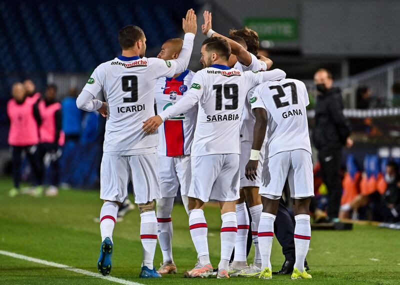 Paris Saint-Germain's French forward Kylian Mbappe celebrates with teammates after scoring against Montpellier. AFP