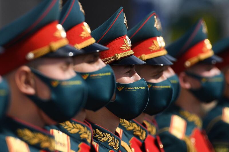 Russian honour guards wearing protective masks attend the opening ceremony of the 6th International Military Technical Forum 'Army 2020' and Army Games in the military Patriot Park outside Moscow.   AFP