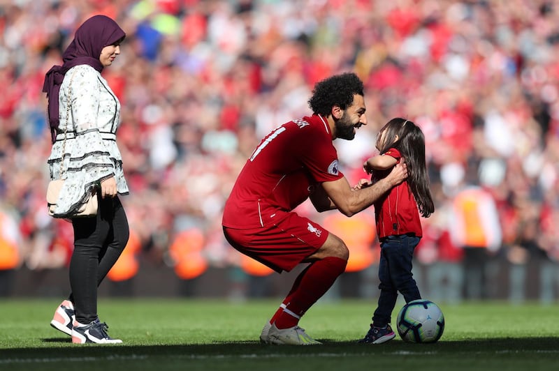 Mohamed Salah of Liverpool speaks to his family after the Premier League match between Liverpool and Wolverhampton Wanderers. Getty Images