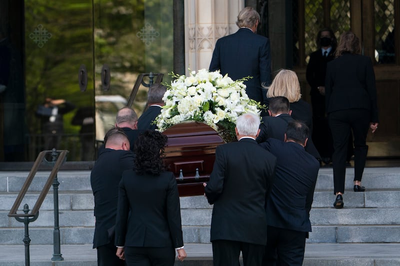 Albright’s coffin is carried into Washington National Cathedral. AP