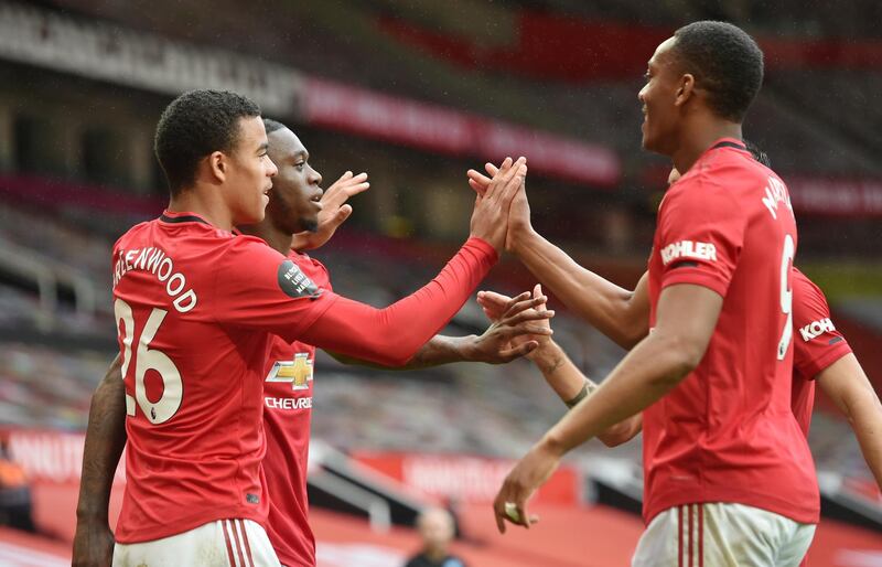 Manchester United's Mason Greenwood celebrates scoring their fourth goal with Aaron Wan-Bissaka and Anthony Martial. Reuters