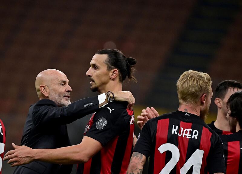 Ibrahimovic is congratulated by AC Milan's Italian coach Stefano Pioli. AFP
