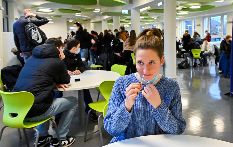 A student tests herself for coronavirus before starting lessons at a grammar school in Dresden, Germany. Reuters