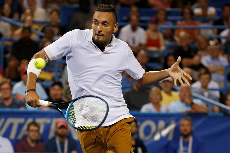FILE PHOTO: Aug 3, 2019; Washington, D.C., USA; Nick Kyrgios of Australia hits a volley against Stefanos Tsitsipas of Greece (not pictured) in a menÕs singles semifinal of the 2019 Citi Open at William H.G. FitzGerald Tennis Center. Mandatory Credit: Geoff Burke-USA TODAY Sports/File Photo