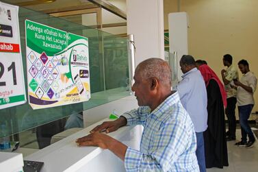 A money transfer service in Somalia on April 2. Remittances are expected to decline the most to Europe and Central Asia, followed by Sub-Saharan Africa and South Asia. Photo: AP